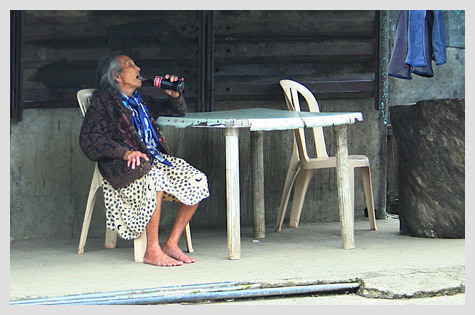 old woman drinking Coke
