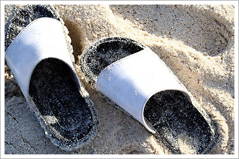 Slippers on sand